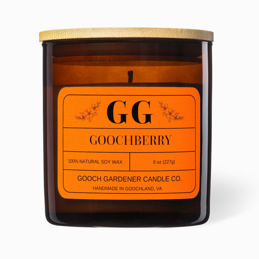 Goochberry candle with orange label and wooden lid on a white background