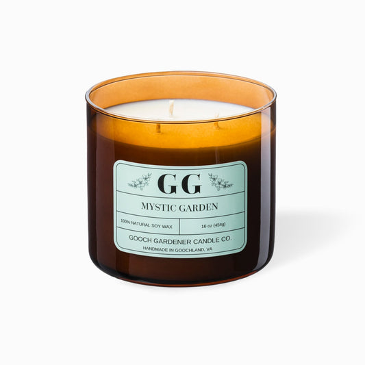 Candle in a brown glass jar with a label on a white background