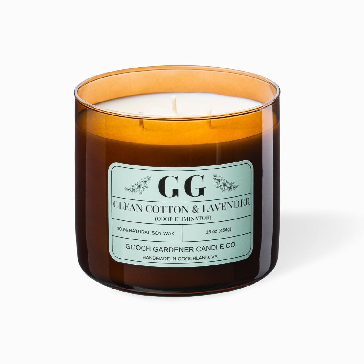 Clean Cotton and Lavender candle in an amber jar with a mint label on a white background.