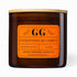 Brown candle with orange label featuring &