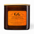 Gooch Gardener Candle Co. ginger root & cinnamon sticks candle with orange label on a white background