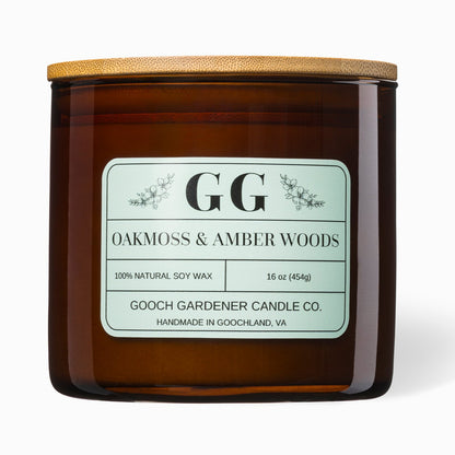 Amber glass candle with wooden lid and label on a white background